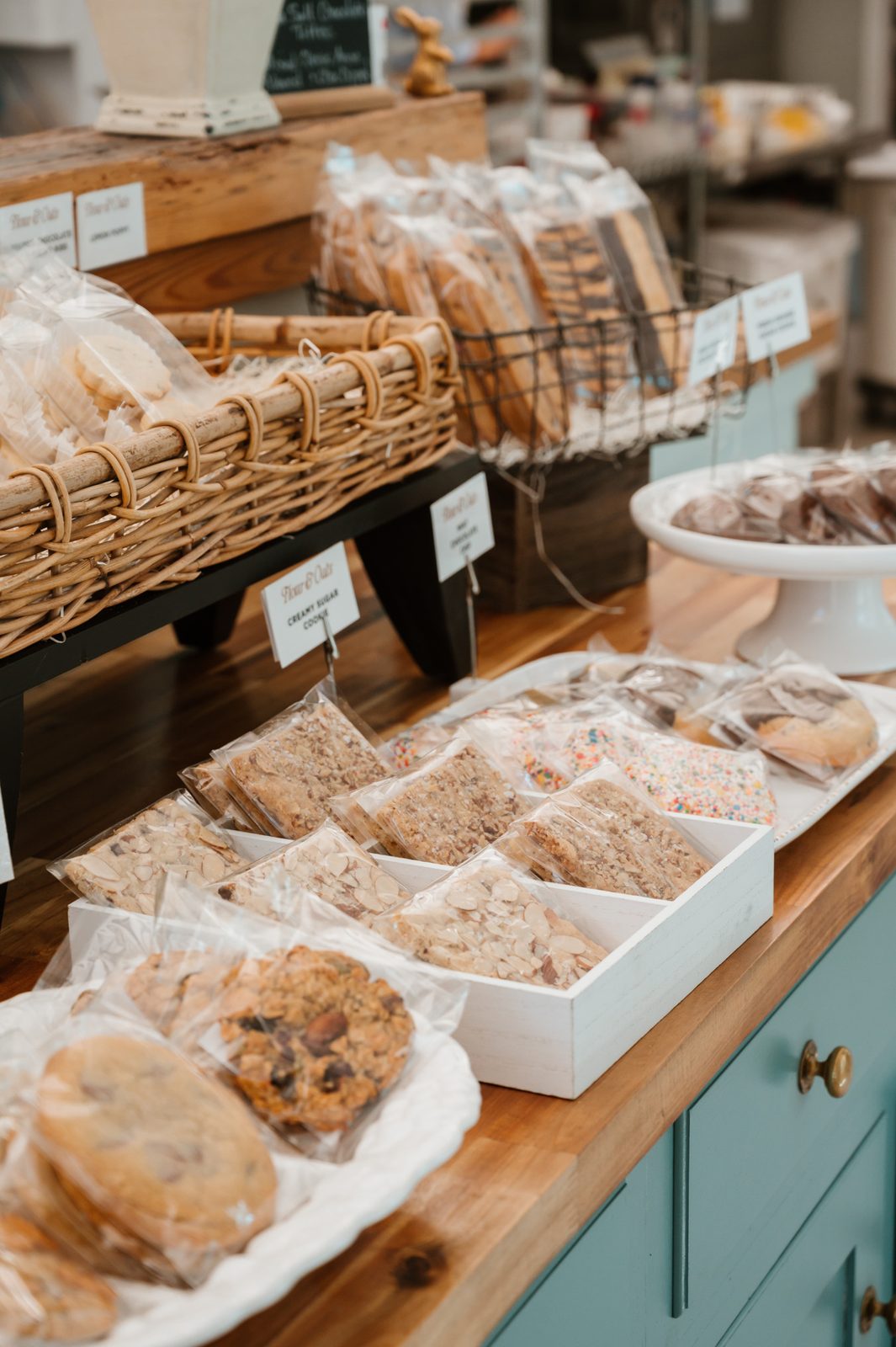 Bakery display case filled with fresh artisan cookies