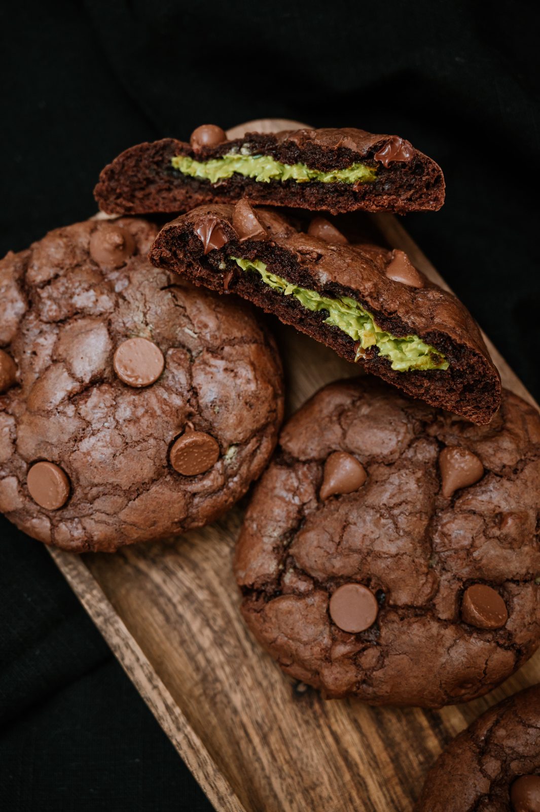 Stack of artisan cookies styled on a dark surface